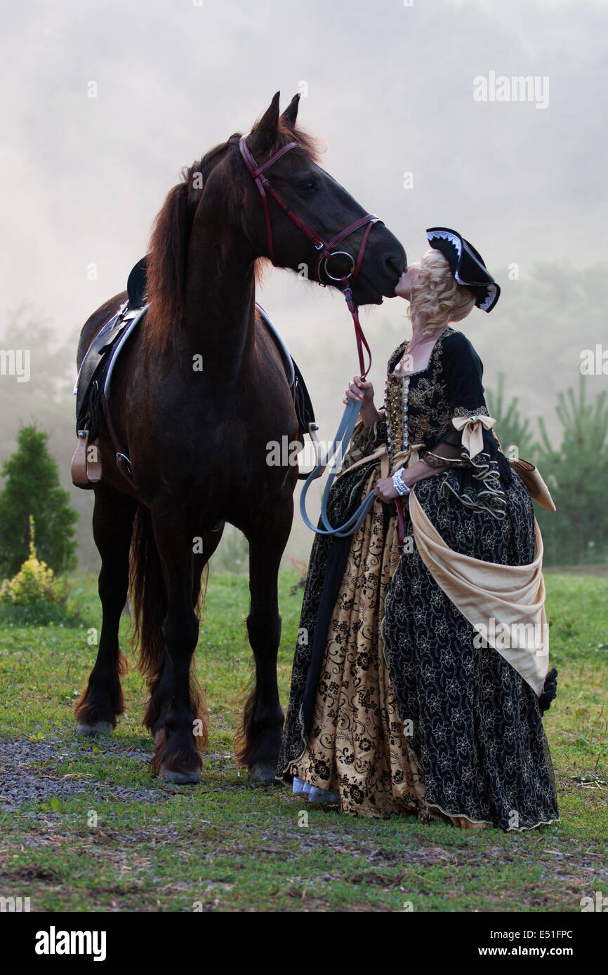 Woman in dress royal baroque riding Stock Photo - Alamy