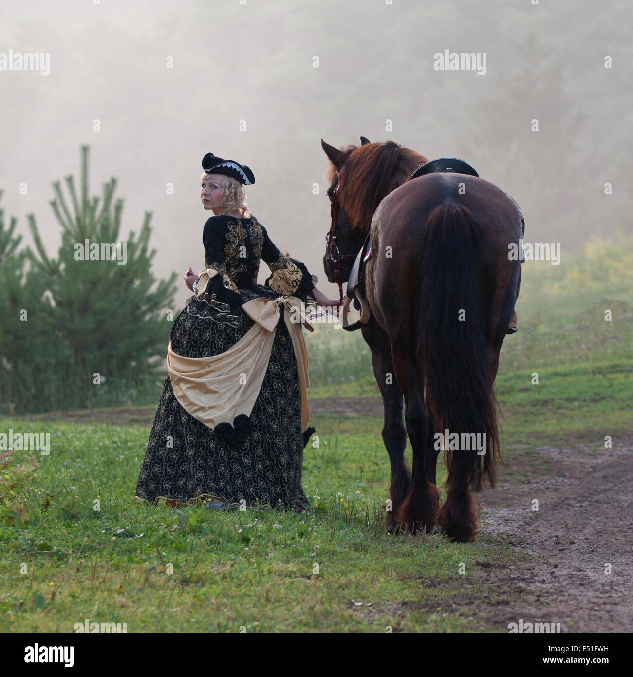 Beautiful woman riding black horse hi-res stock photography and images ...