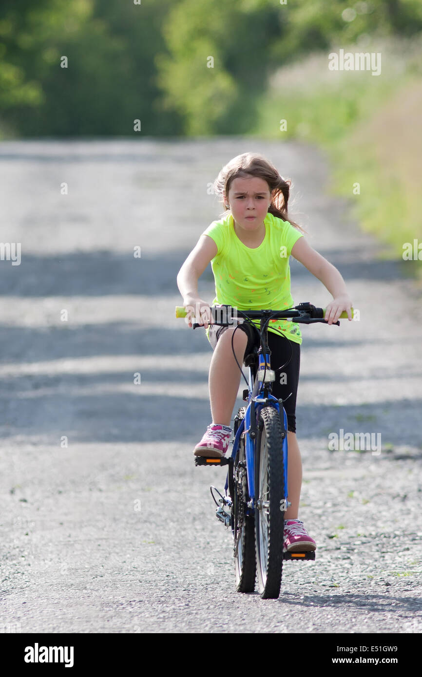 Teens girl on bike Stock Photo