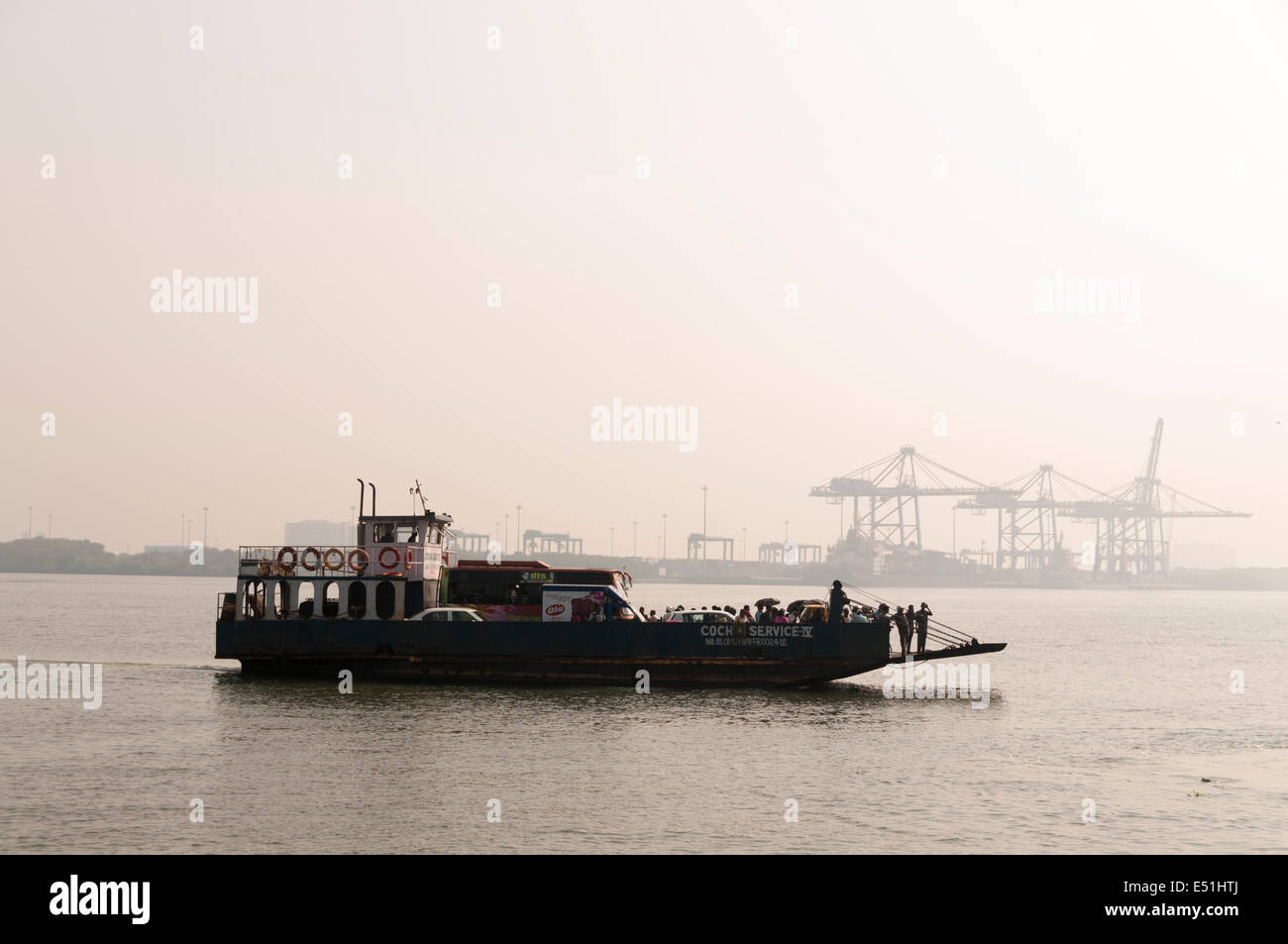 Ferry boat carrying people and cars, India Stock Photo