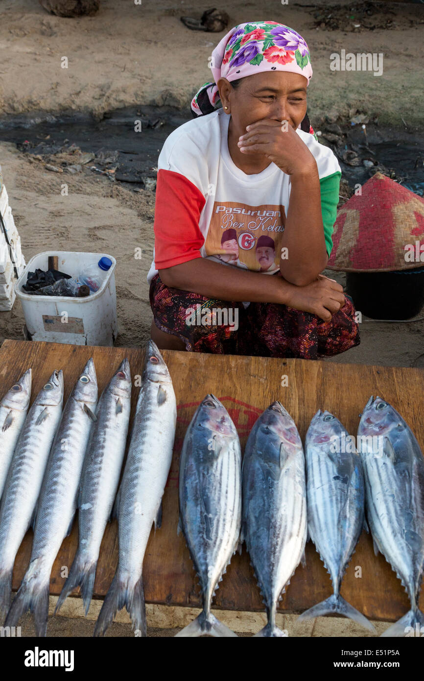Jimbaran, Bali, Indonesia.  Woman Selling Fish on the Beach, early Morning. Stock Photo