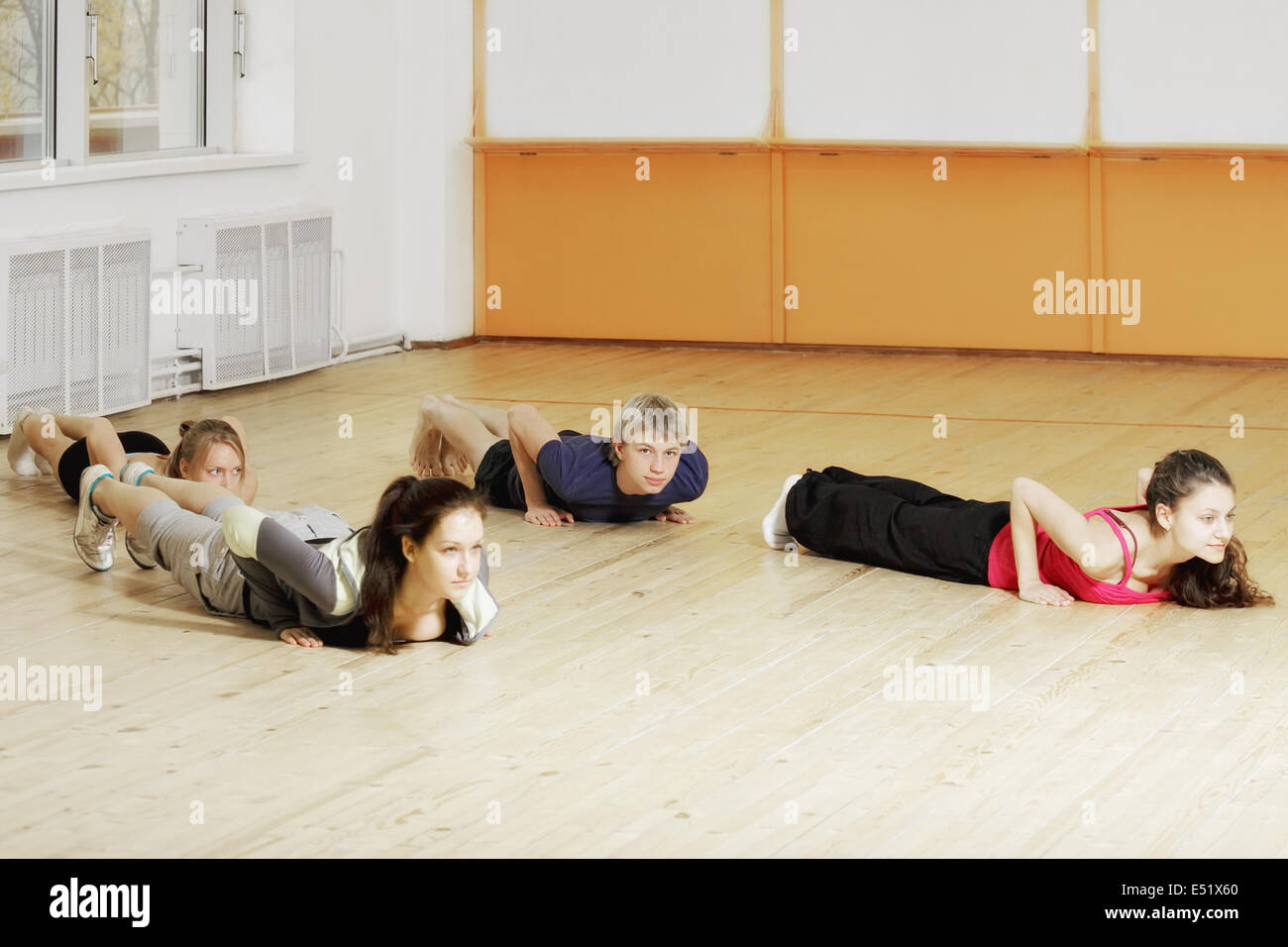 People laying down on the floor Stock Photo