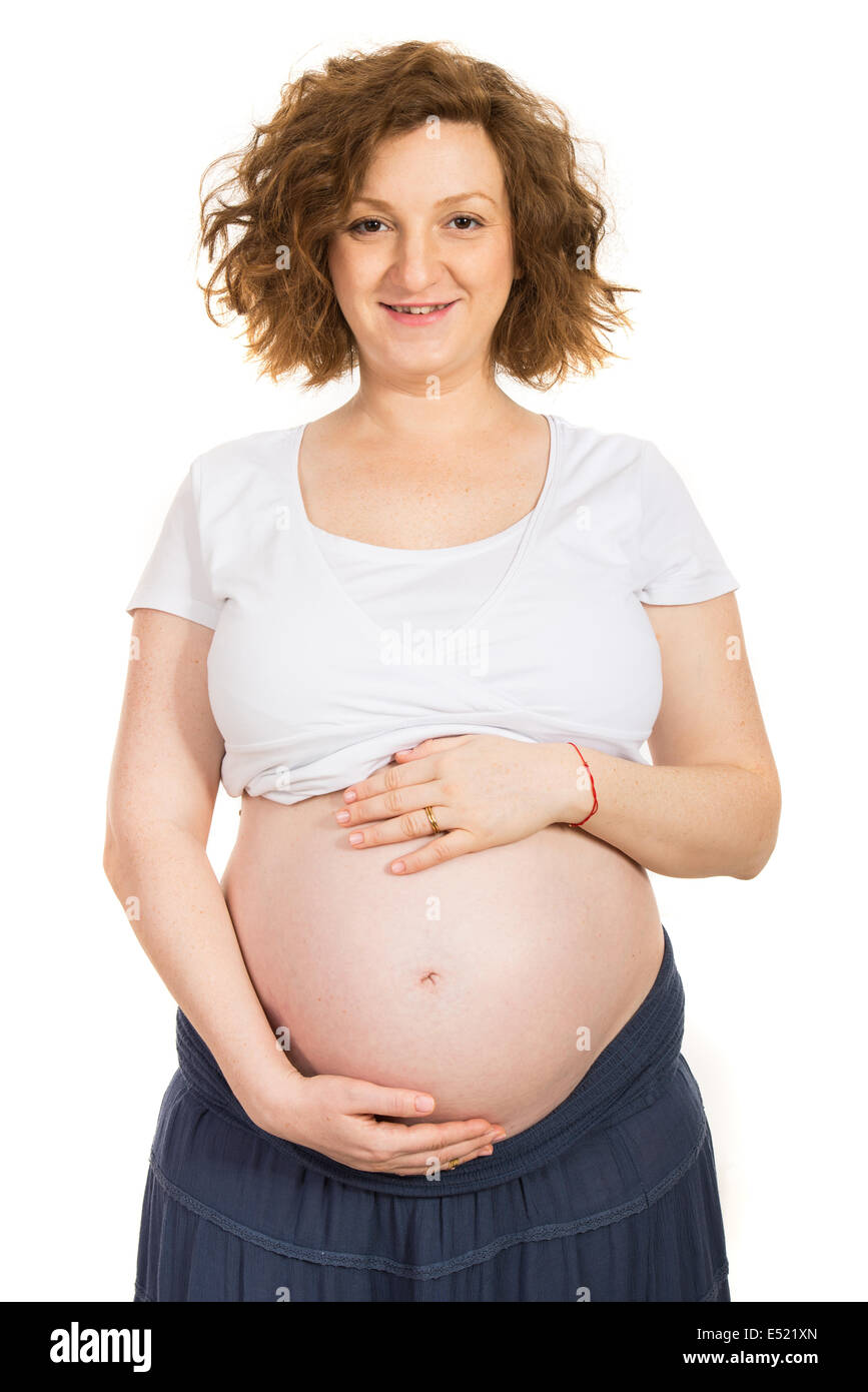 Attractive pregnant woman holding belly isolated