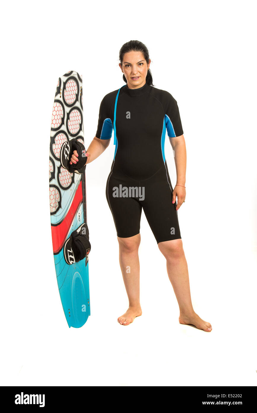 Surfer woman in neoprene suit holding  surf board isolated on white background Stock Photo