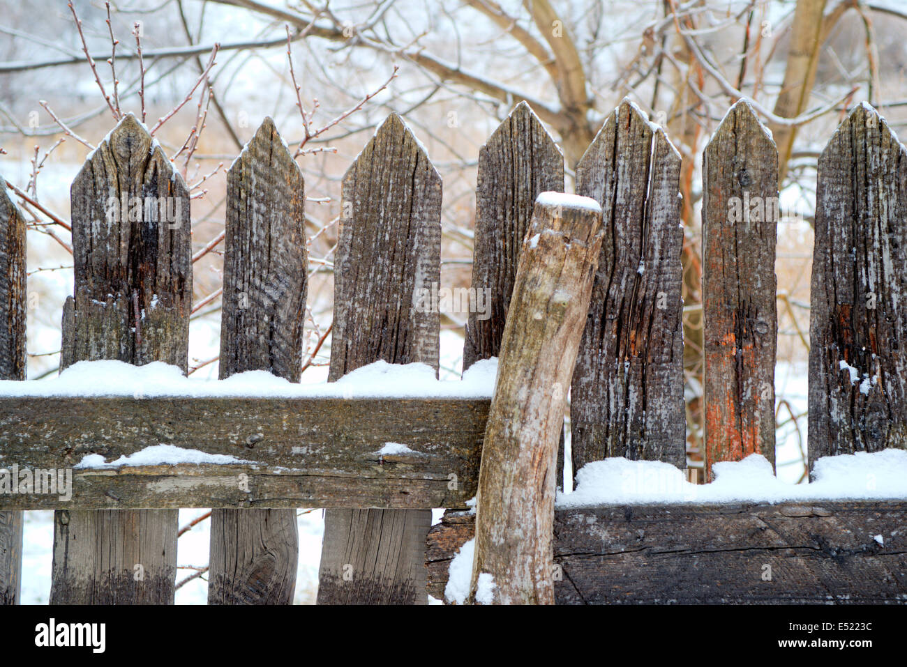 Old wooden fence under snow Stock Photo - Alamy