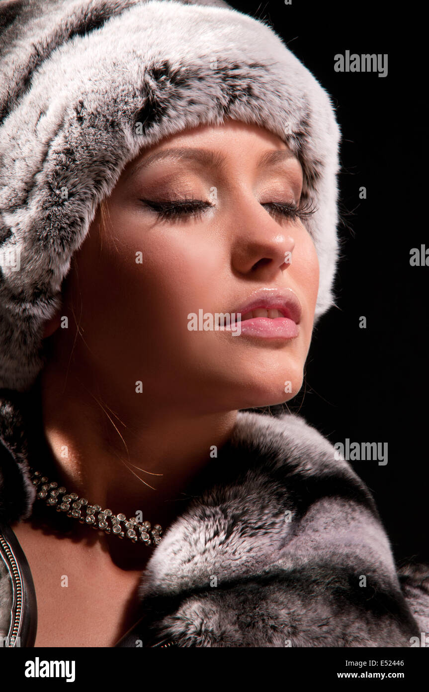 Portrait of young woman in fur coat hi-res stock photography and images ...