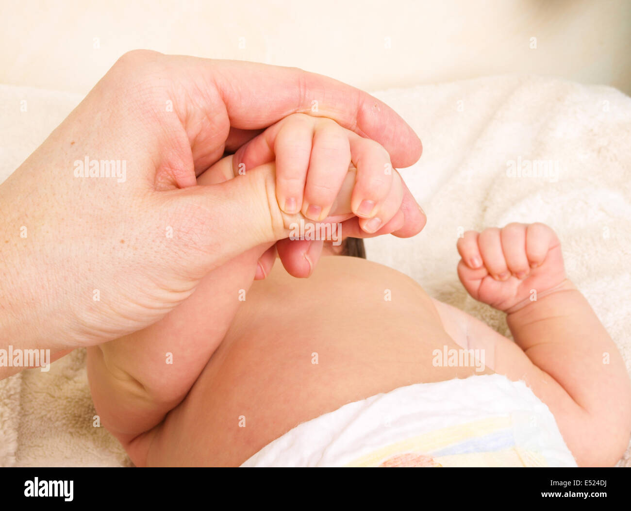 First touch newborn with parent Stock Photo