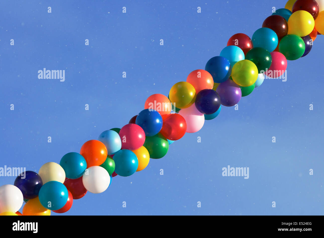 Child blowing balloons hi-res stock photography and images - Alamy