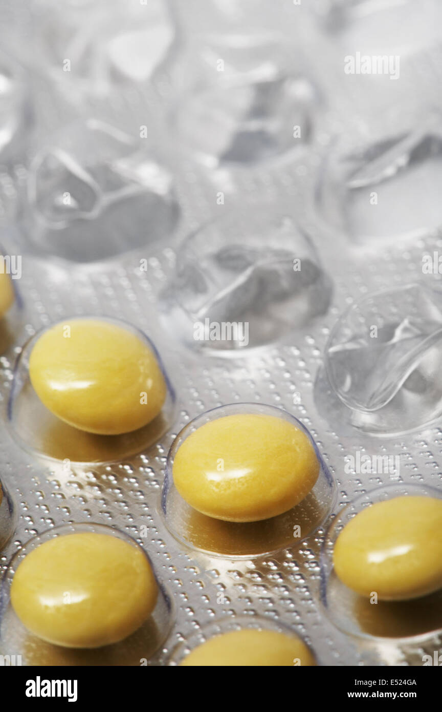 Yellow and round tablets Stock Photo Alamy