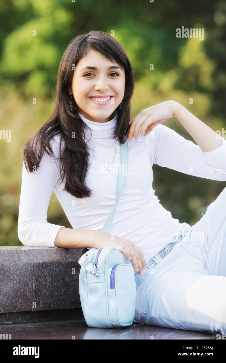 Smiling woman with a blue bag Stock Photo