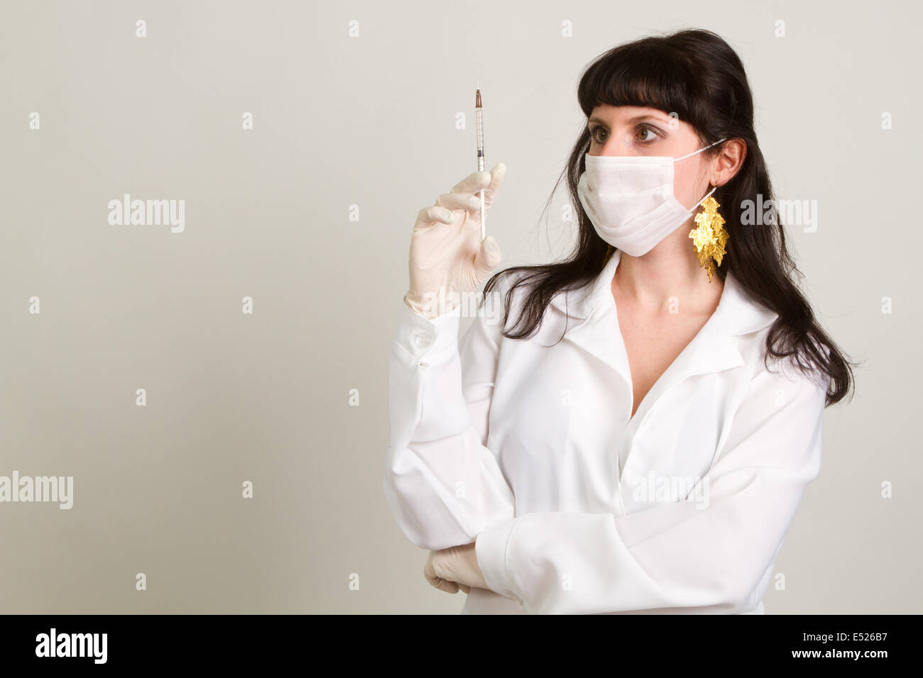 doctor  in gloves showing ampule Stock Photo