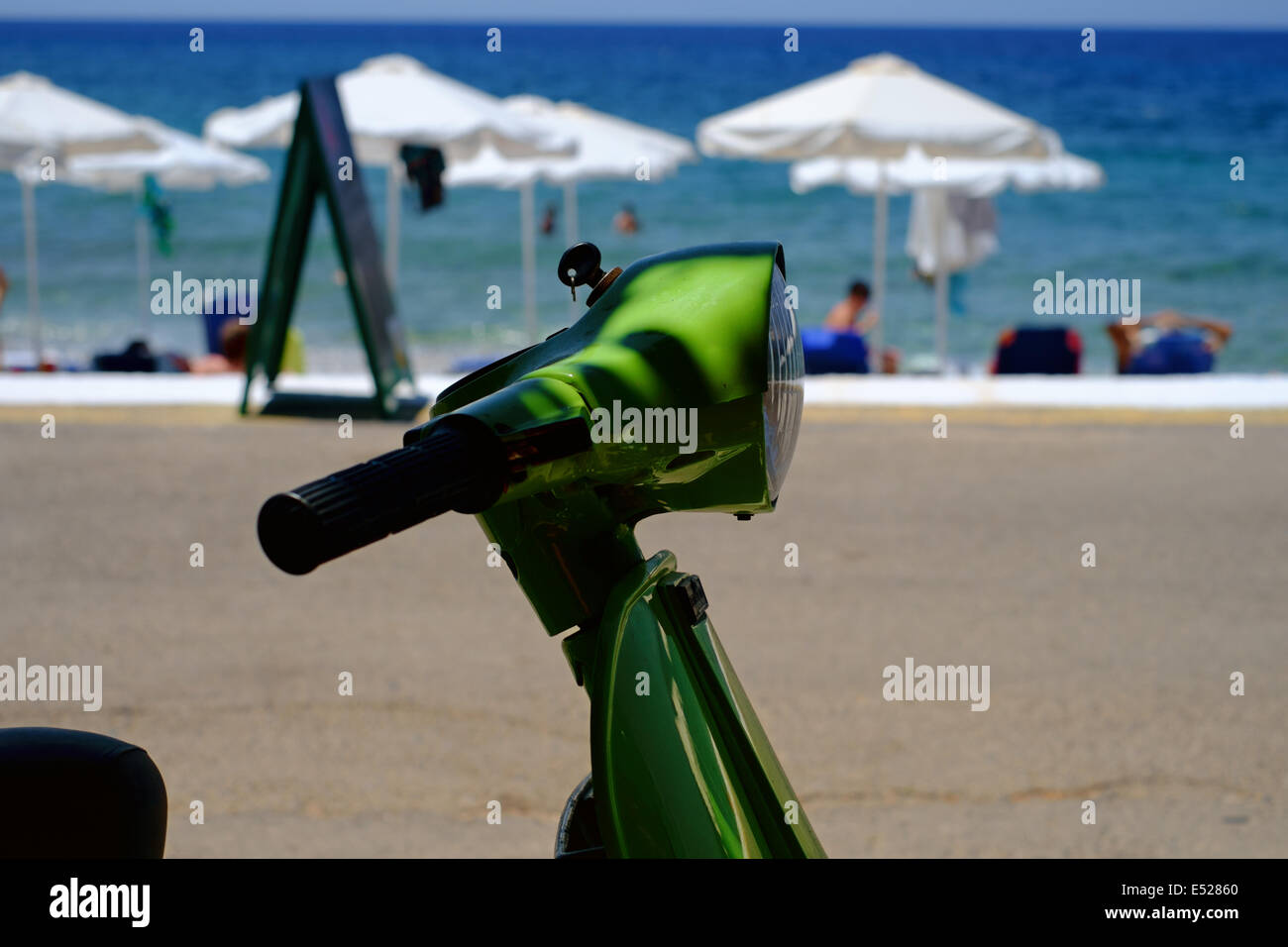 MANI PENINSULA, MESSINIA, PELOPONNESE, GREECE, 14th July 2014. Vespa Piaggio motor scooter parked at the beach Stock Photo