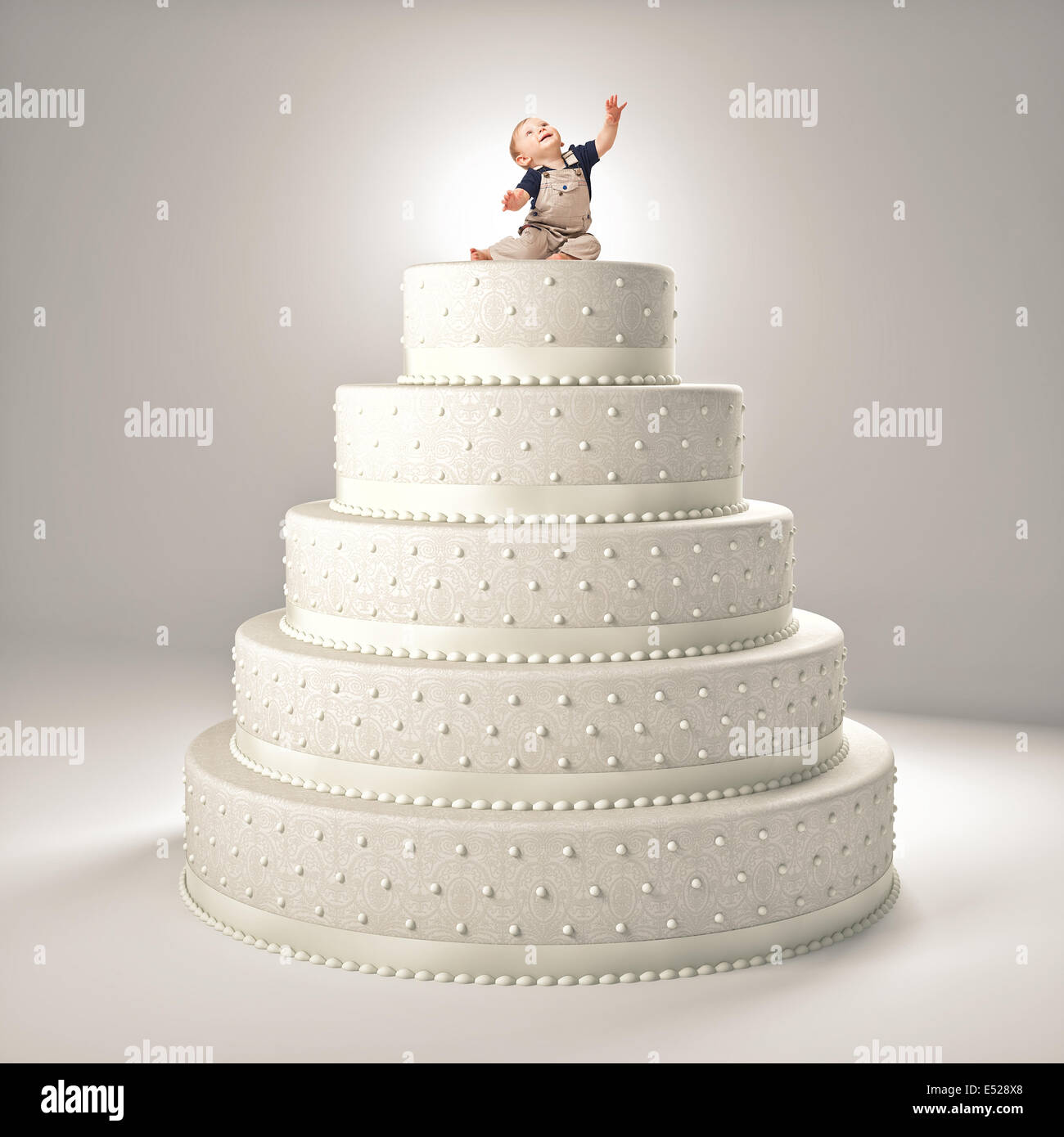 little cute child on top of the cake Stock Photo