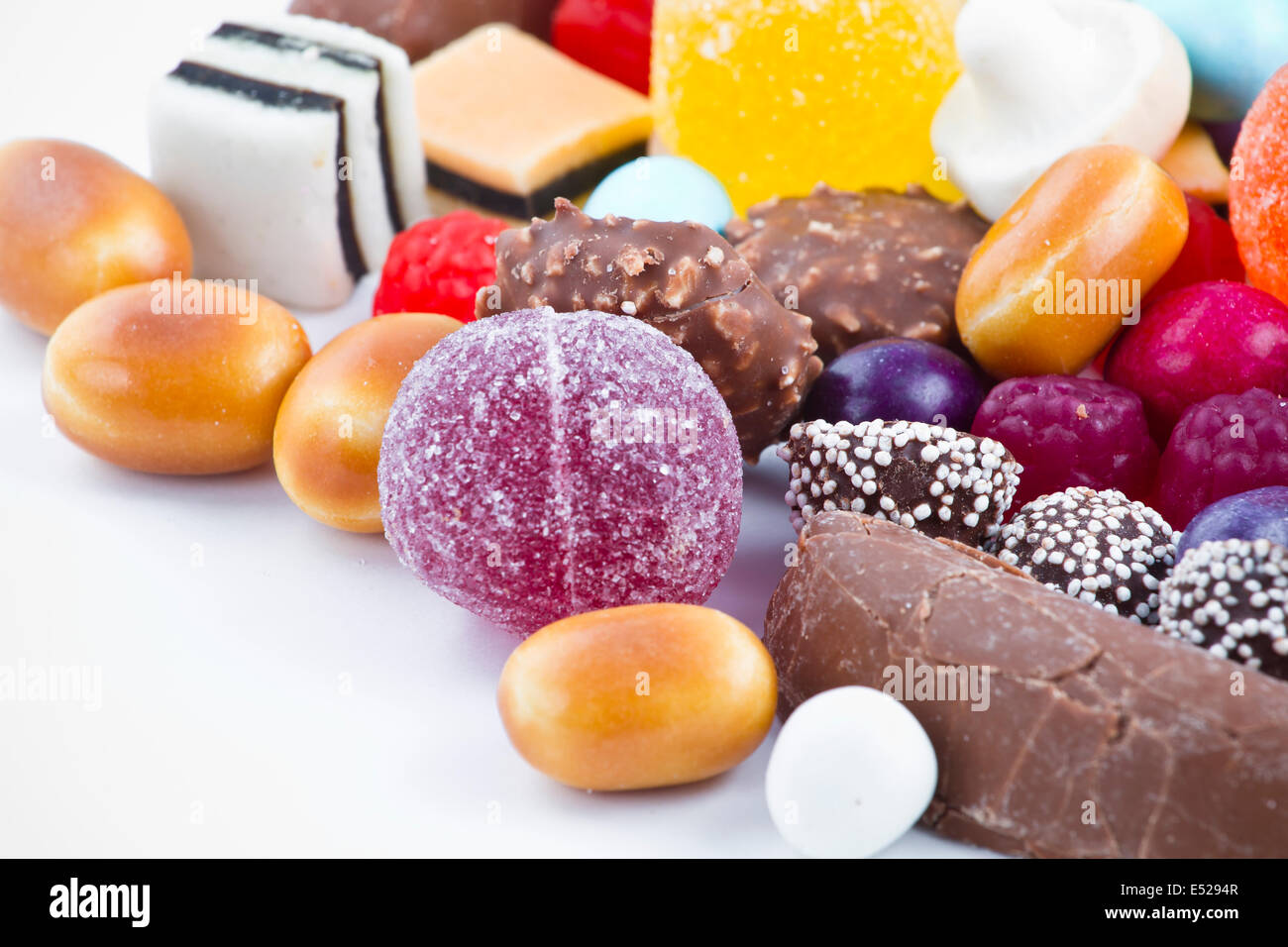 Many candy on white background Stock Photo - Alamy