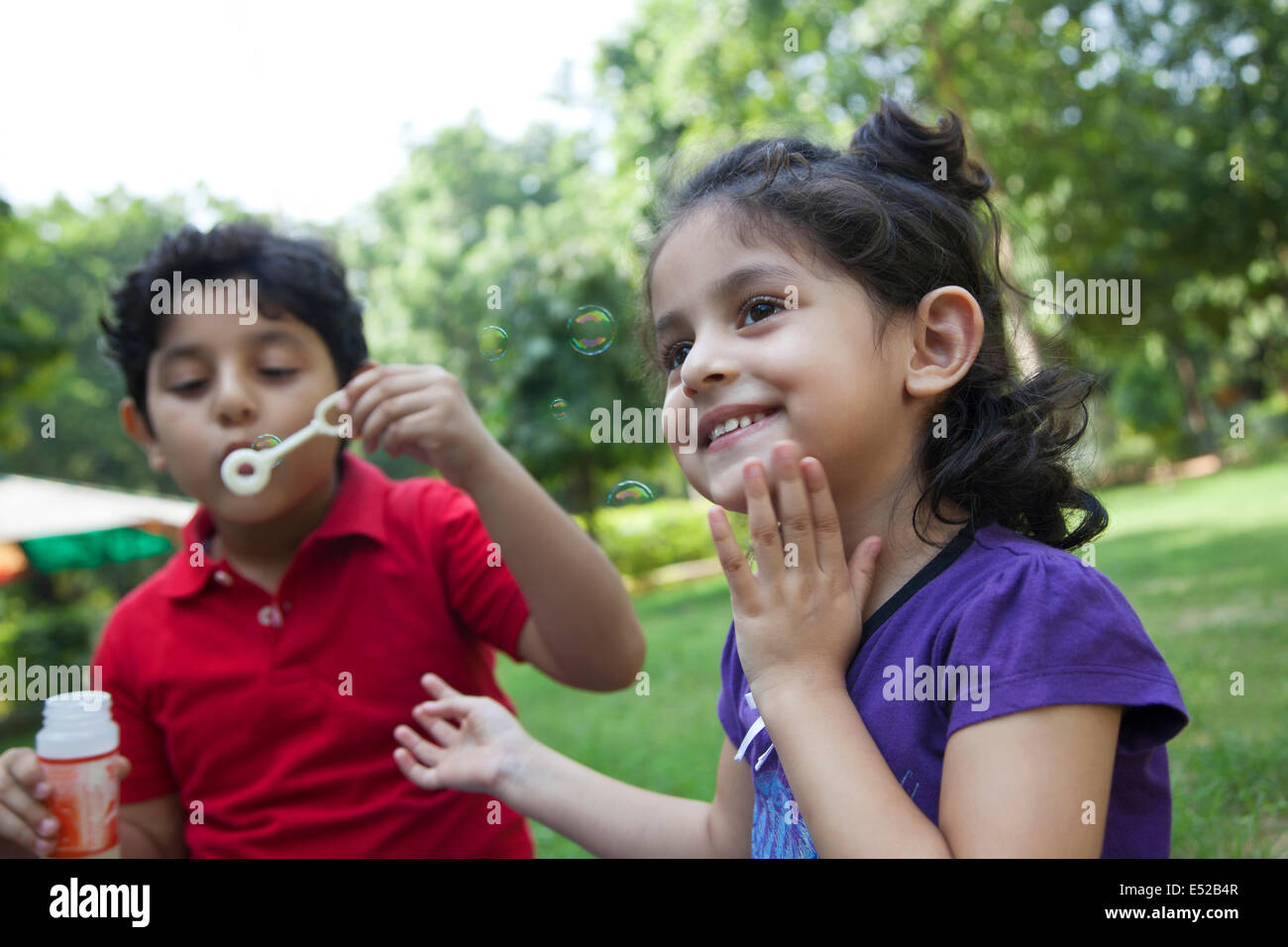 Boy and girl in park Stock Photo