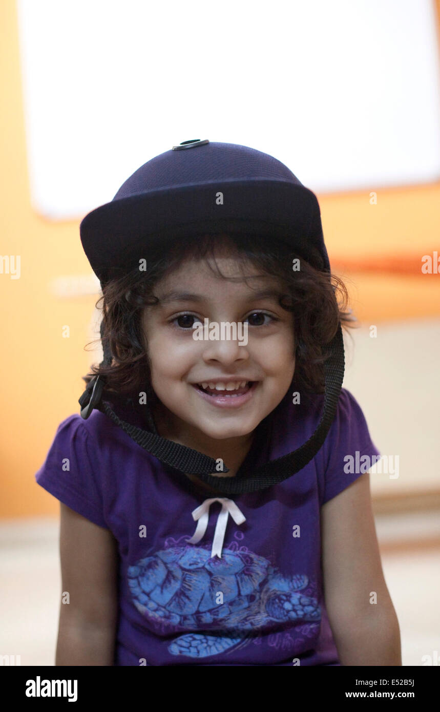 Portrait of a little girl wearing a helmet Stock Photo