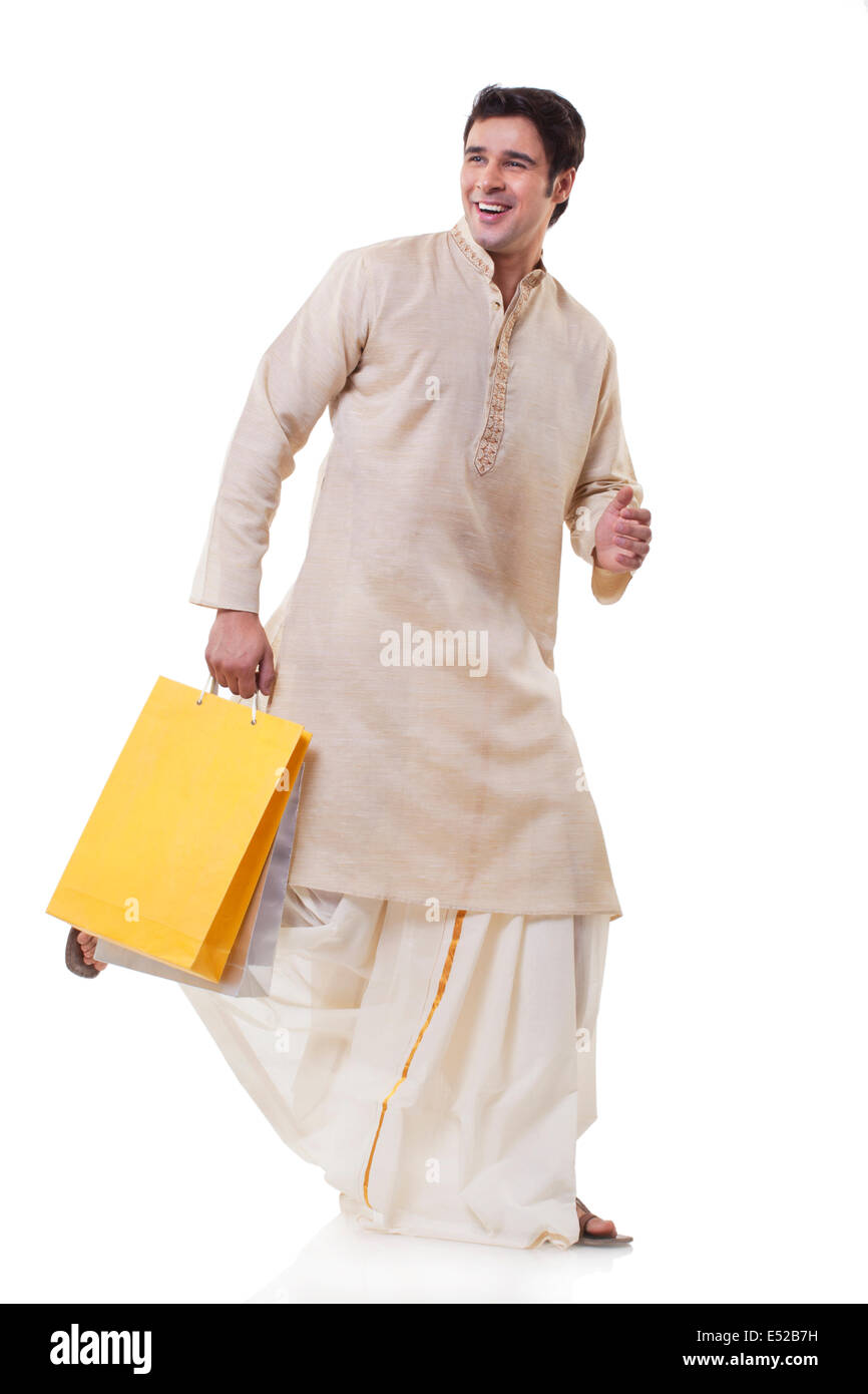 Bengali man running with shopping bags Stock Photo