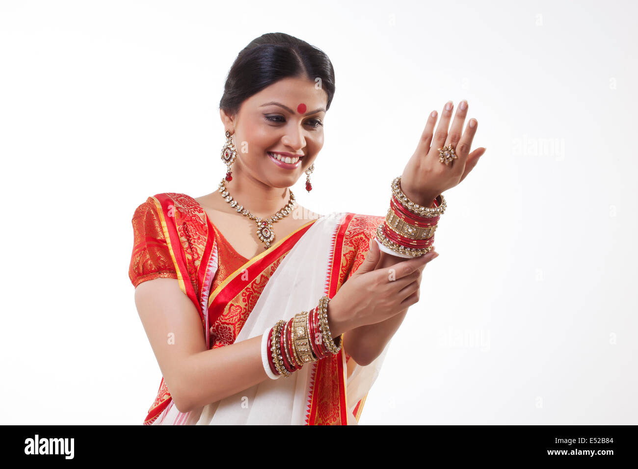 Bengali woman looking at her bangles Stock Photo