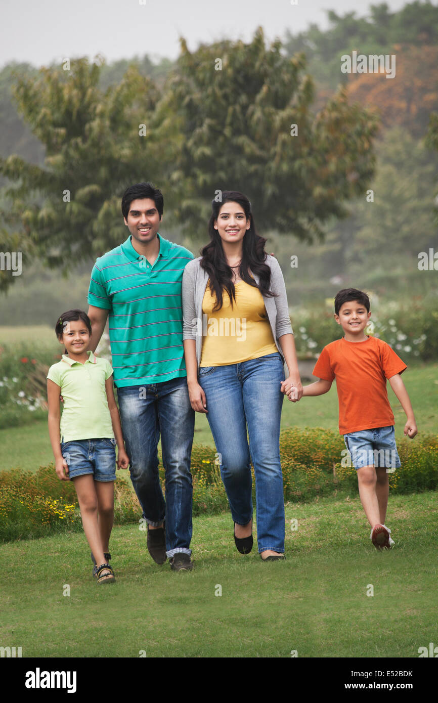 Portrait of a family in a park Stock Photo - Alamy