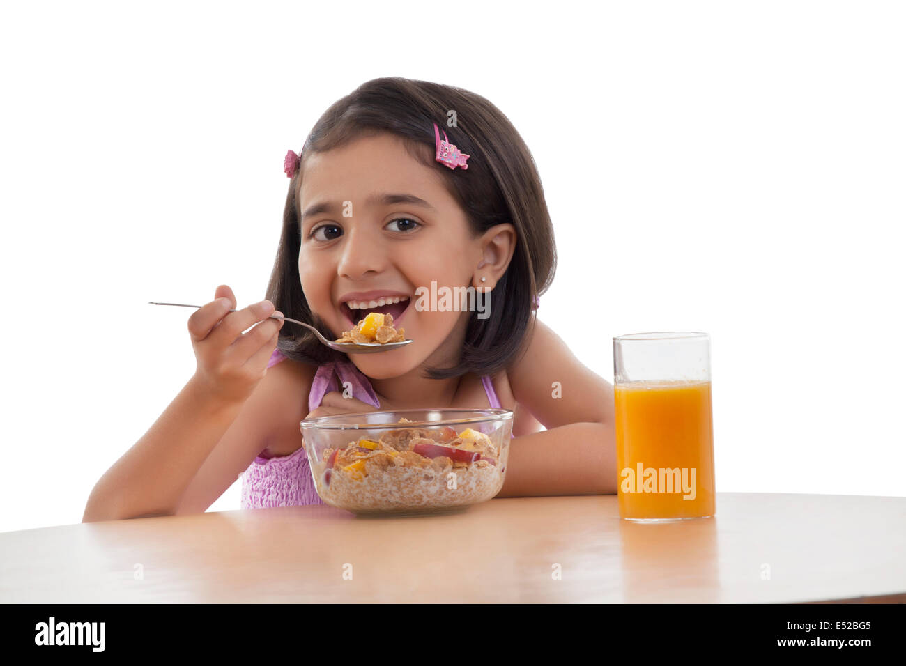 Indian girl eating breakfast hi-res stock photography and images - Alamy