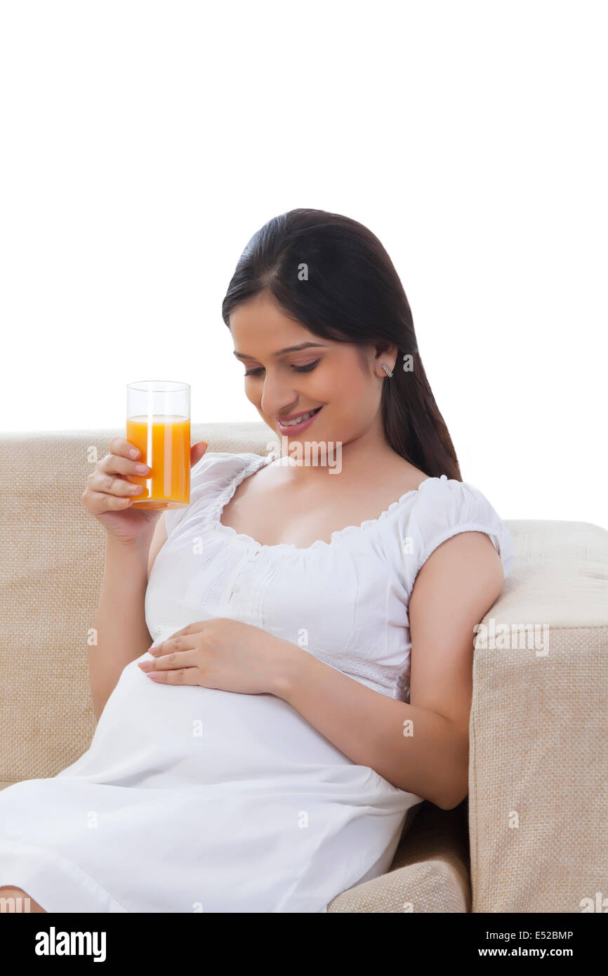Pregnant woman drinking juice Stock Photo Alamy