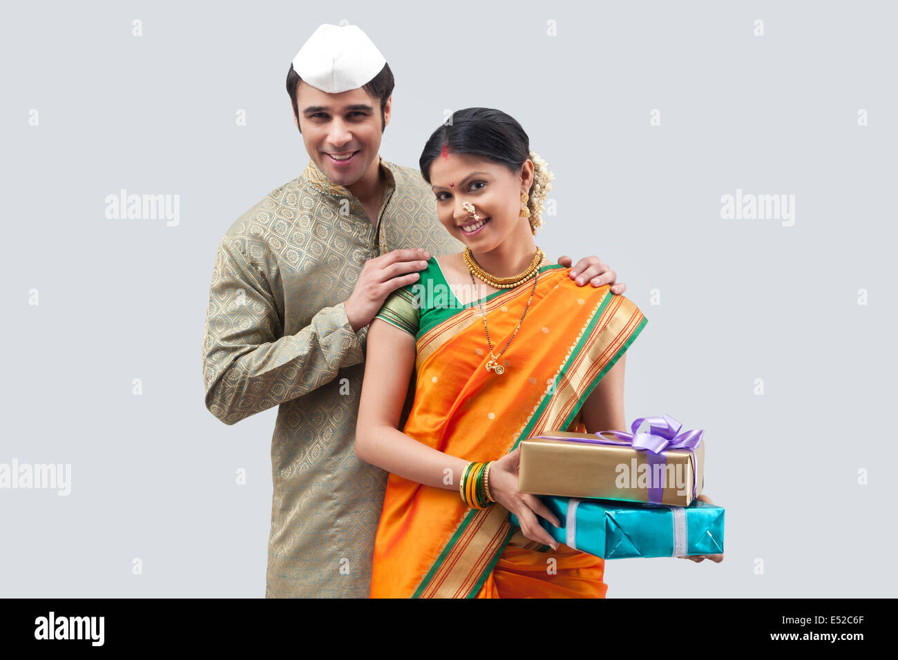 Portrait of Maharashtrian couple holding gifts Stock Photo