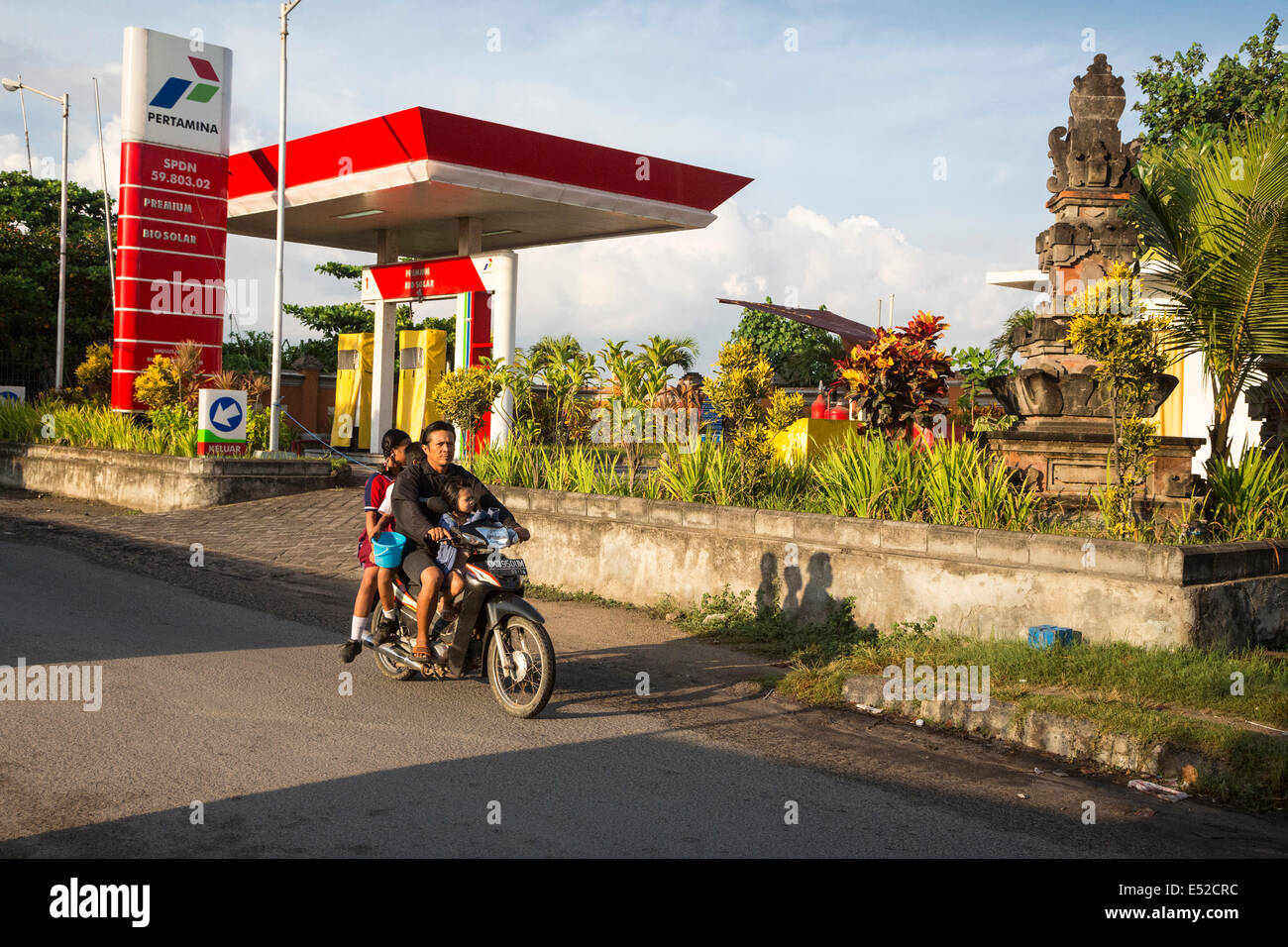 Bali, Indonesia.  Father and Three Children on a Motorbike, no Helmets. Stock Photo