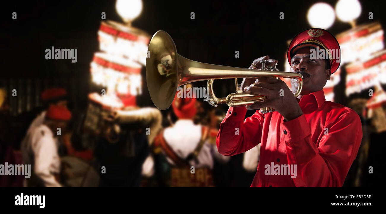 Bandmaster playing on a trumpet Stock Photo