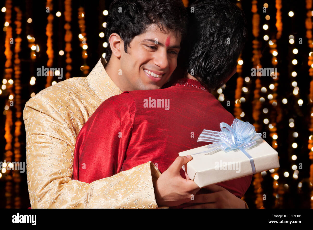 Two men hugging each other Stock Photo - Alamy