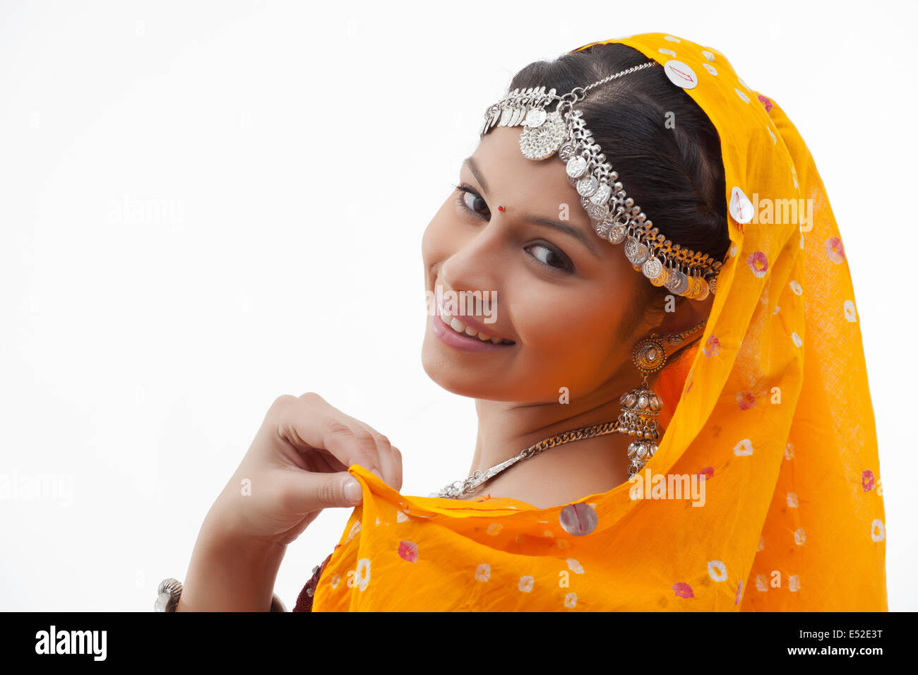 Close-up portrait of young woman smiling against white background Stock ...