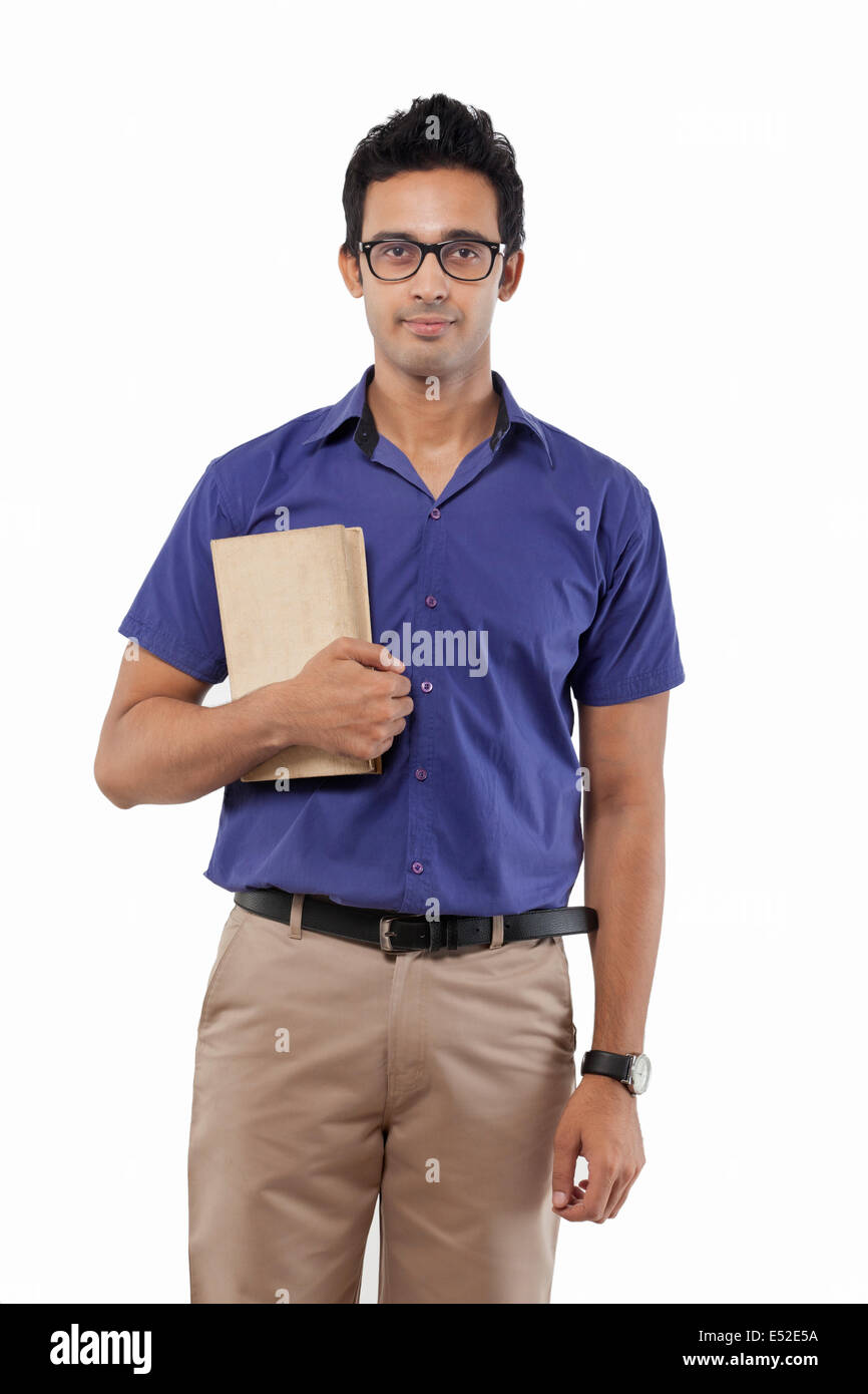 Portrait of a young man with a book Stock Photo - Alamy