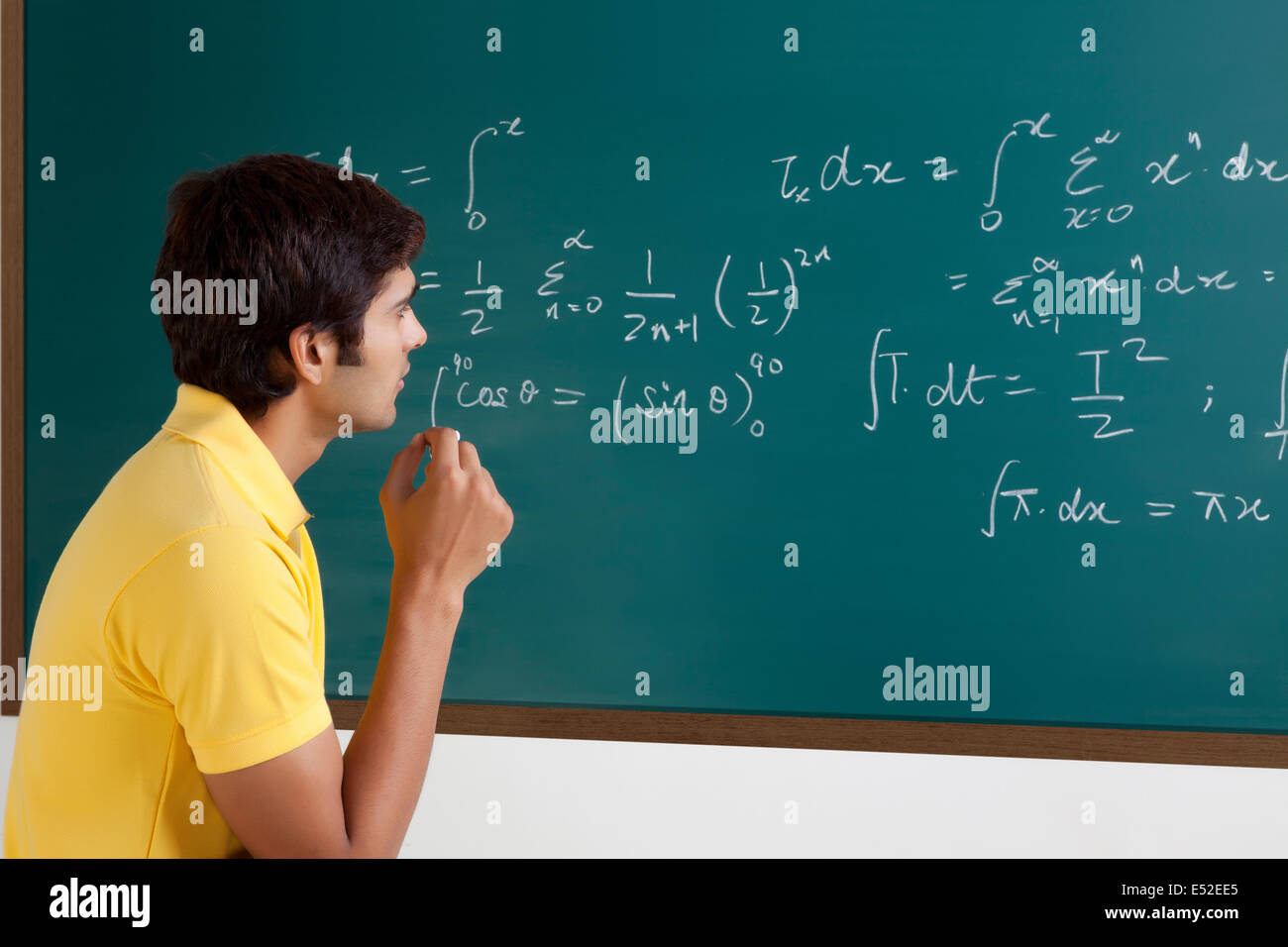 College student trying to solve a maths equation Stock Photo