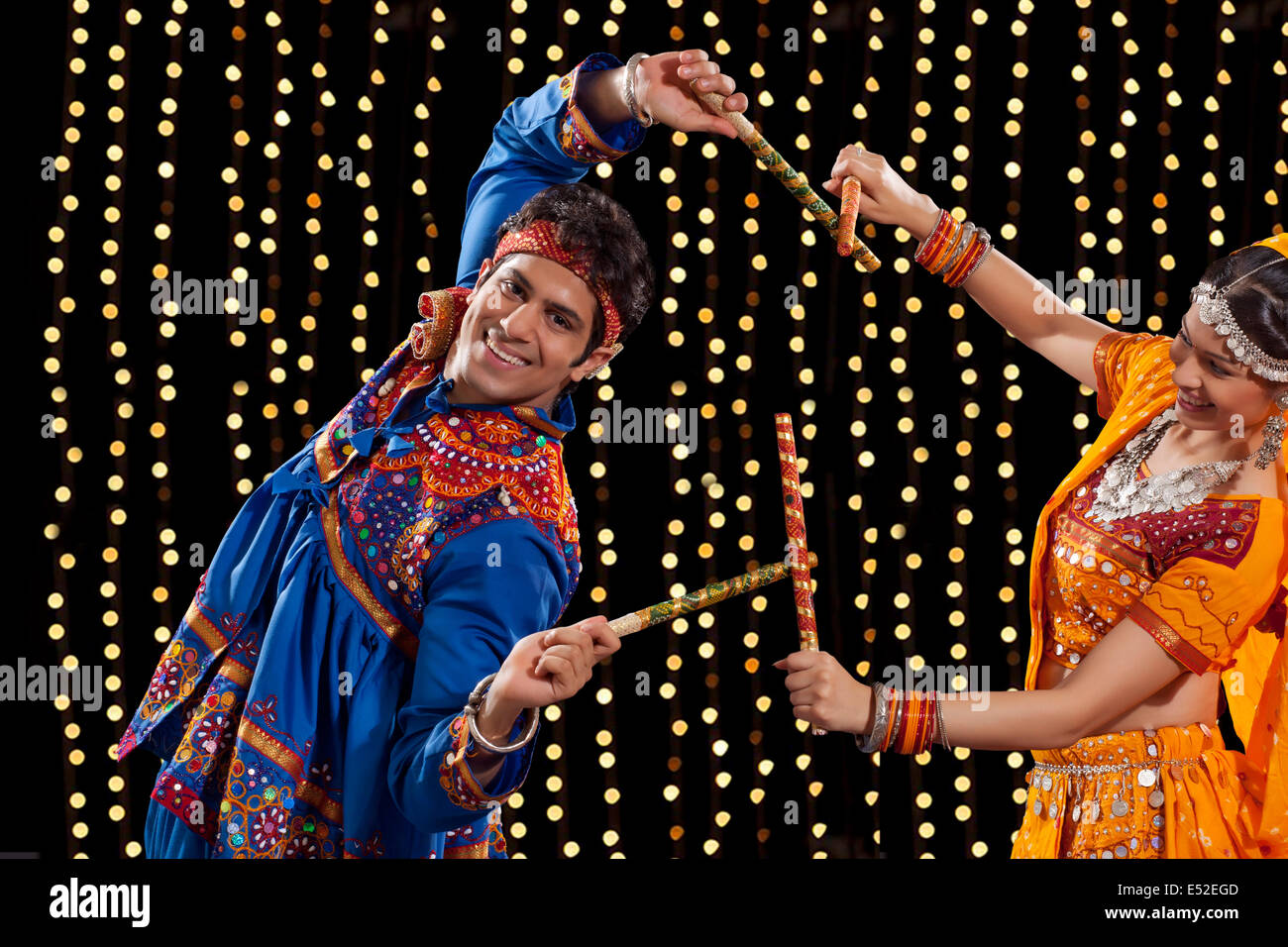 Two women performing dandiya hi-res stock photography and images - Alamy