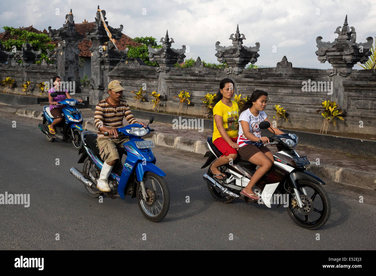 Bali Indonesia Men And Women On Motorbikes No Helmets Stock Photo Alamy