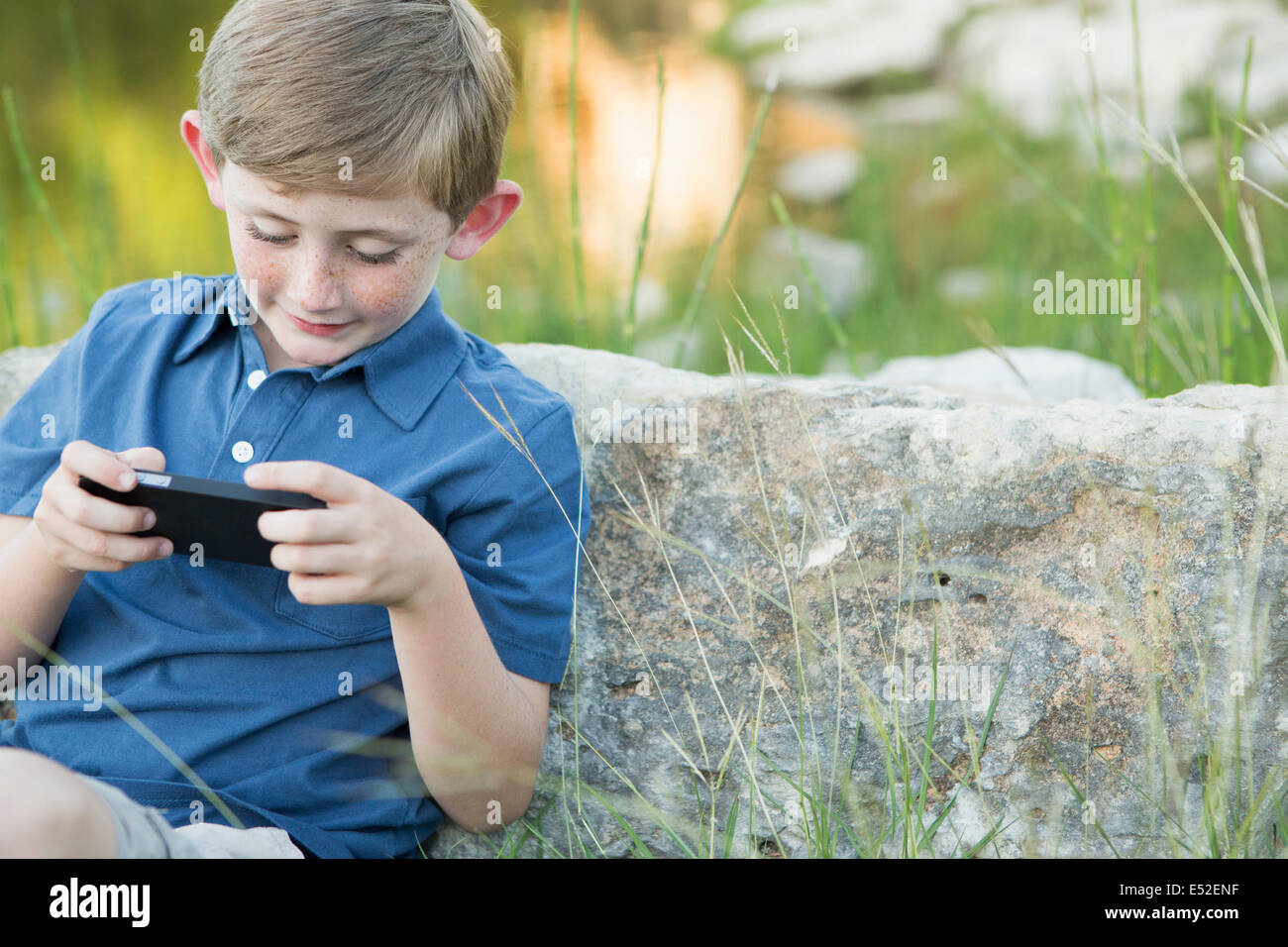 Leaning against a rock hires stock photography and images Alamy