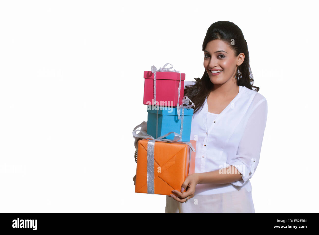 Portrait of a woman holding gift boxes Stock Photo