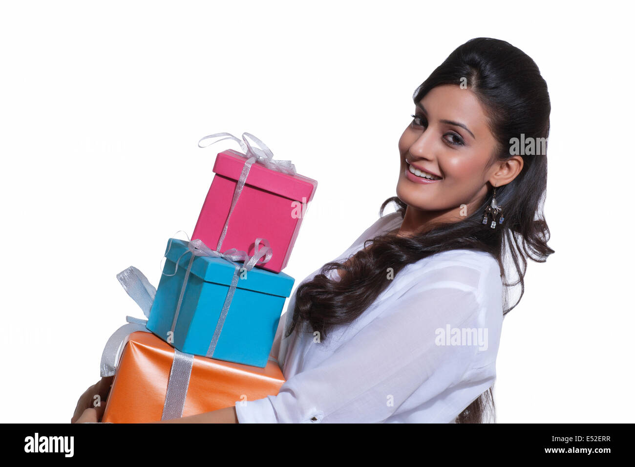 Portrait of a woman holding gift boxes Stock Photo