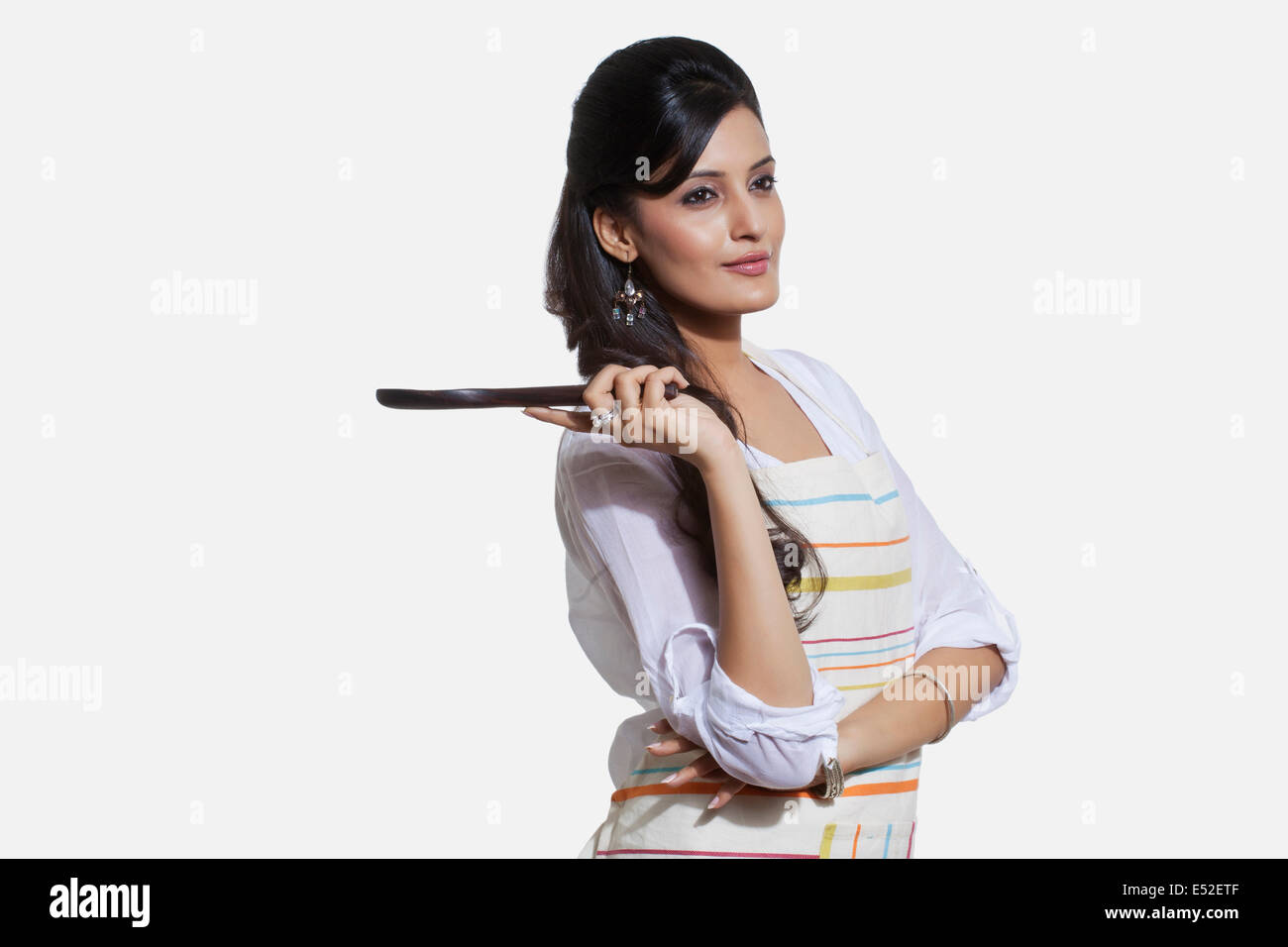 Woman with a cooking utensil Stock Photo