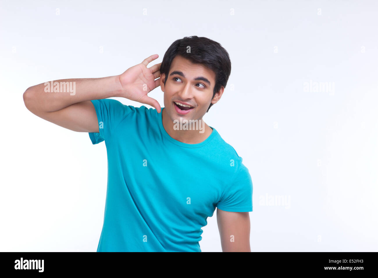 Surprised Young Man Listening Carefully Isolated Over White Background 