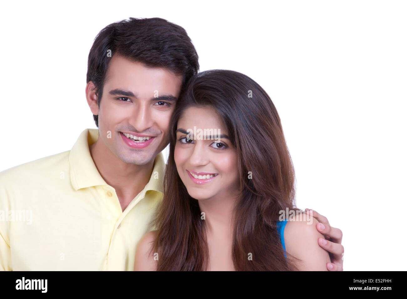 Portrait of loving young couple over white background Stock Photo - Alamy