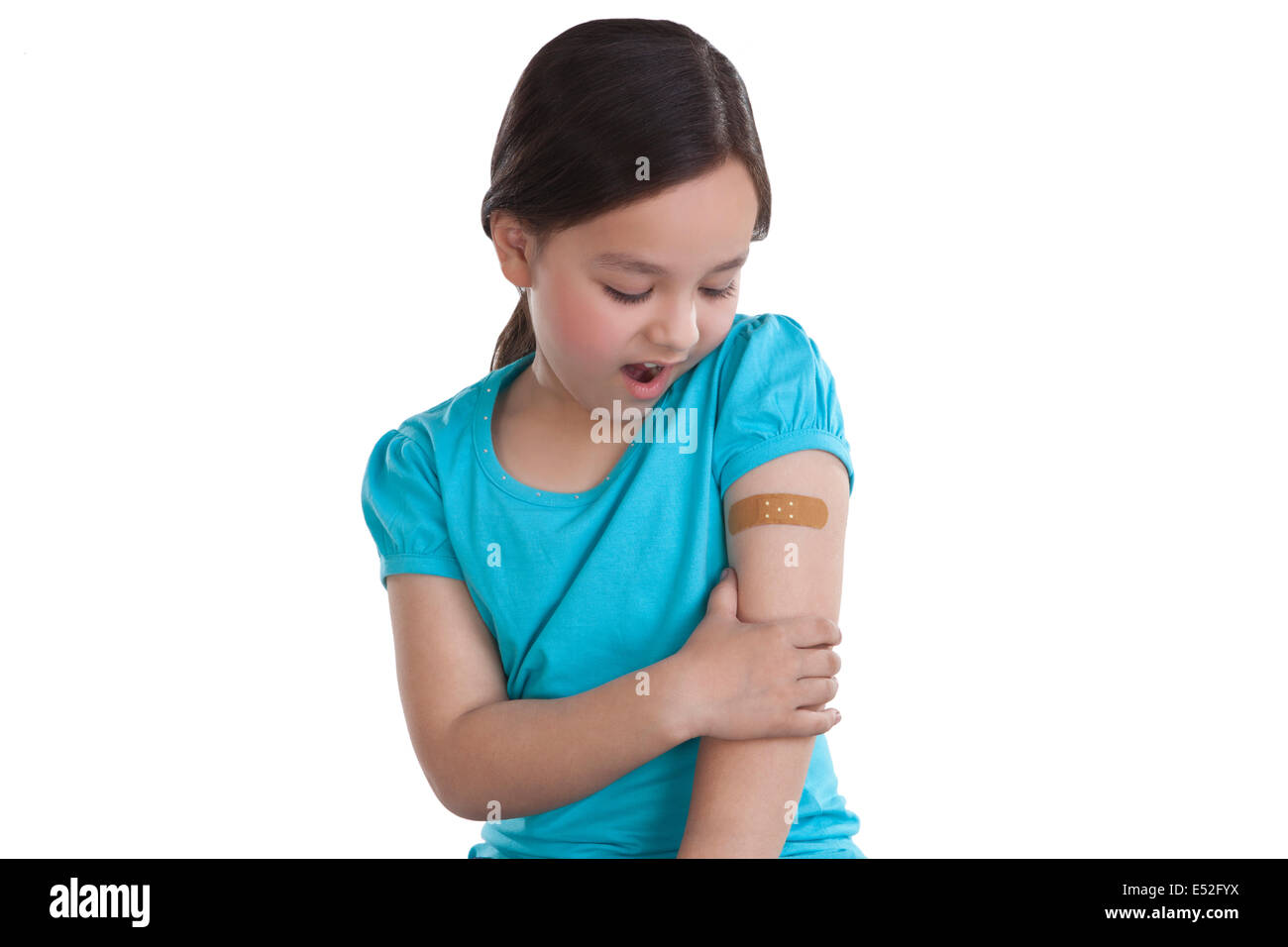 Little girl with band-aid on arm Stock Photo