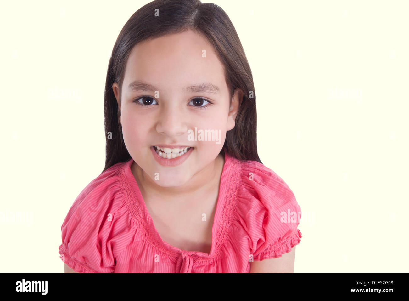 Portrait of little girl showing her teeth Stock Photo - Alamy