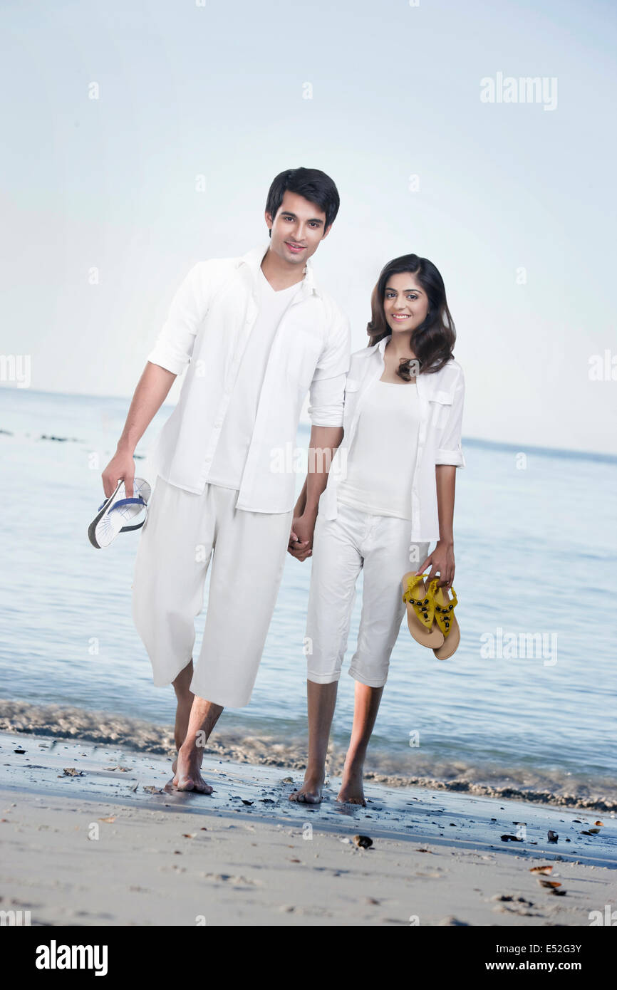 Indian couple holding hands walking hi-res stock photography and images ...