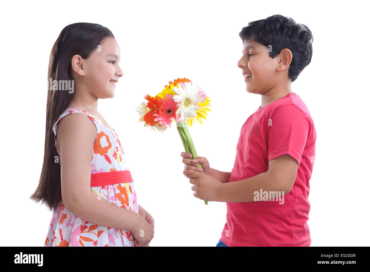 Girl giving boy flowers hires stock photography and images Alamy
