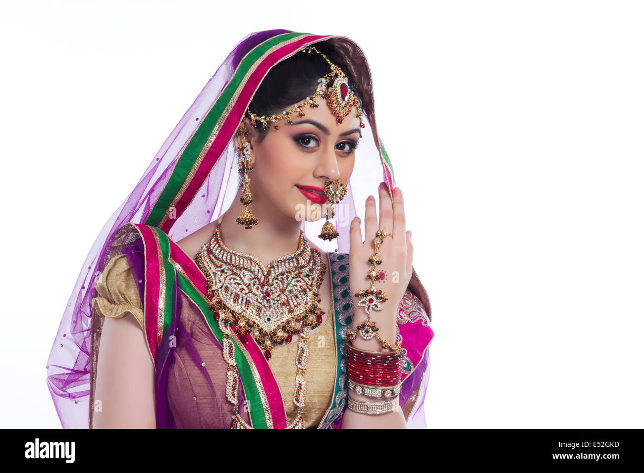 Portrait Of Beautiful Indian Bride Against White Background Portrait Of Beautiful Indian Bride Against White Background