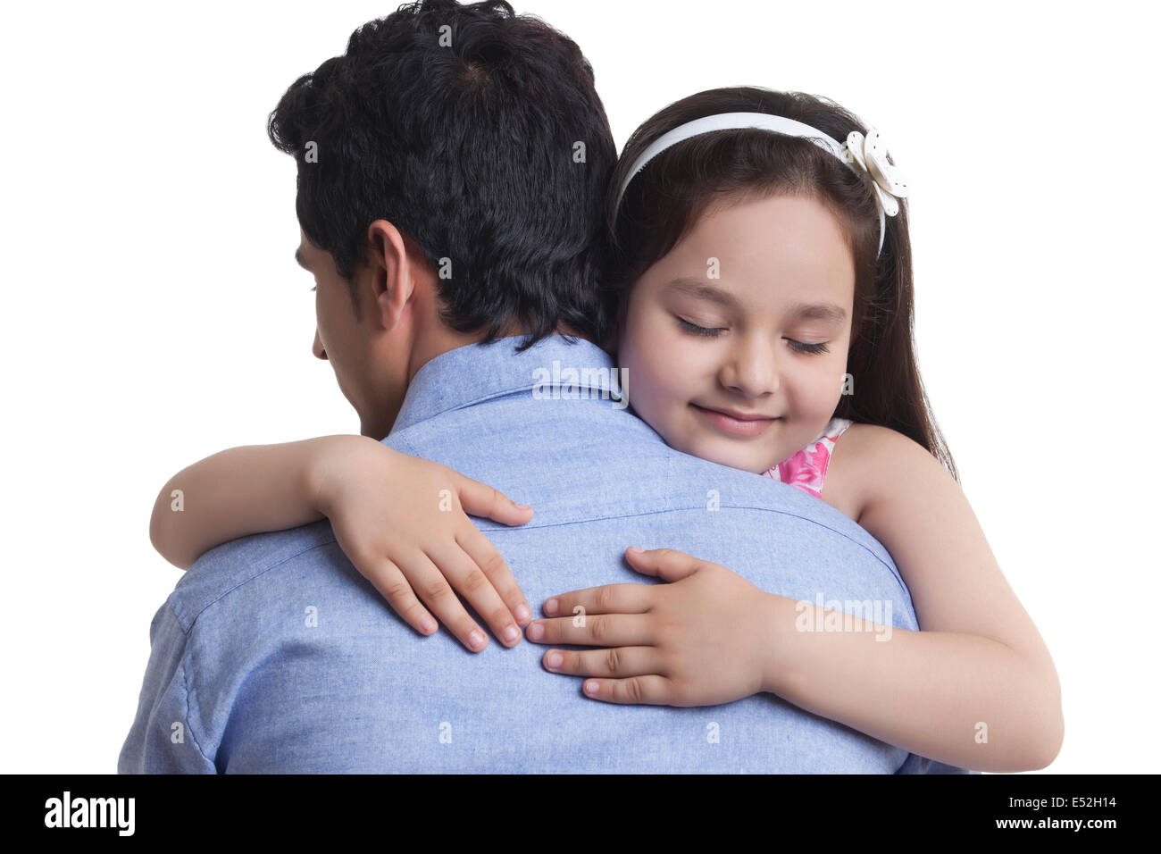 Girl embracing father over white background Stock Photo