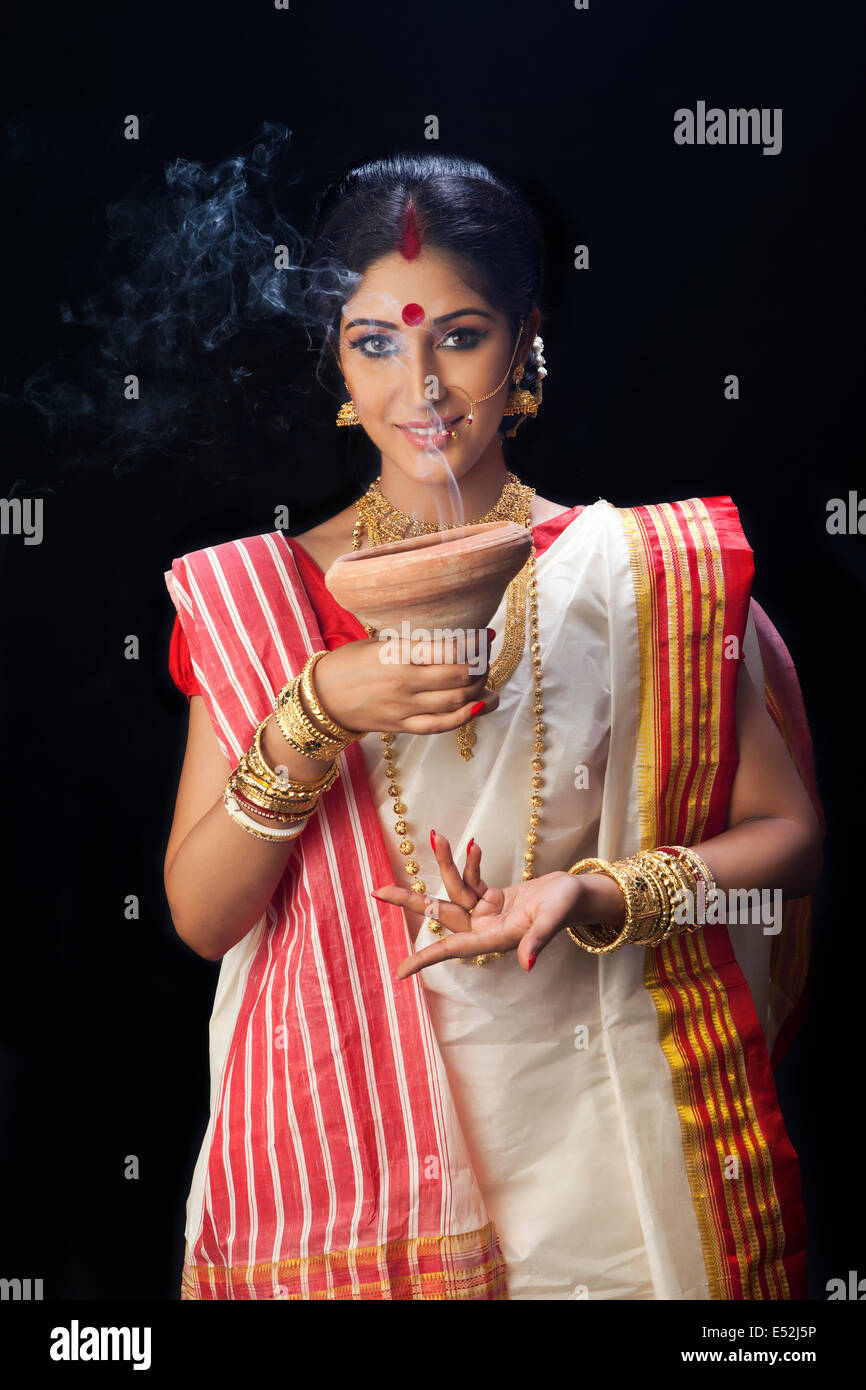 Portrait of Bengali woman holding a dhunuchi Stock Photo Alamy