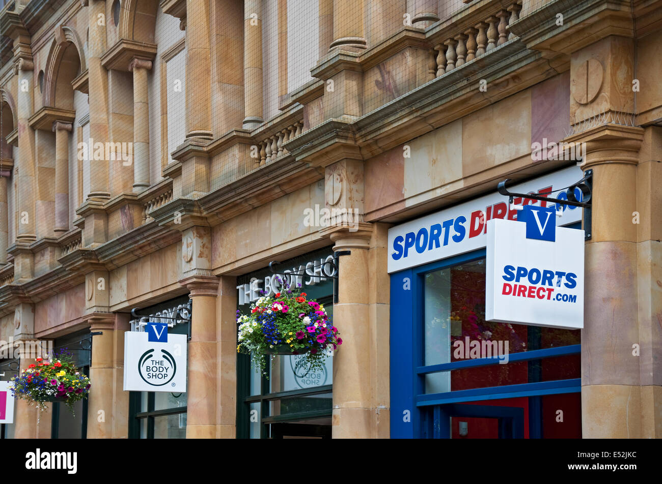 Close up of Hanging signs shops stores outside Victoria Shopping Centre Harrogate North Yorkshire England UK United Kingdom GB Great Britain Stock Photo