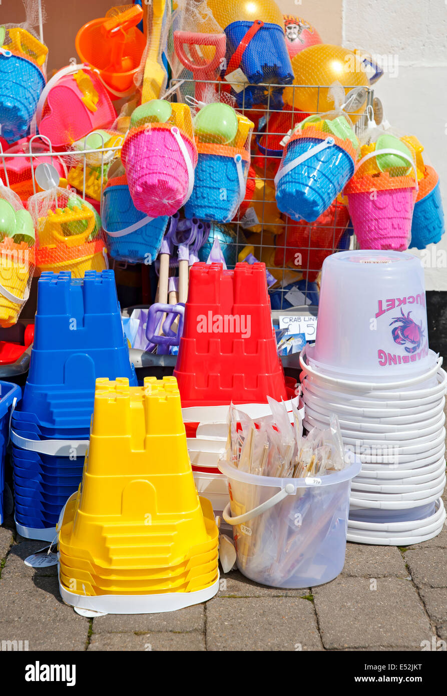 Close up of Plastic buckets and spades outside store shop kids beach ...