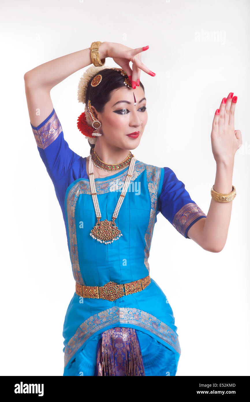 Bharatnatyam Dancer In A Devi Lakshmi Pose During Her Performance On A Dark  Background High-Res Stock Photo - Getty Images